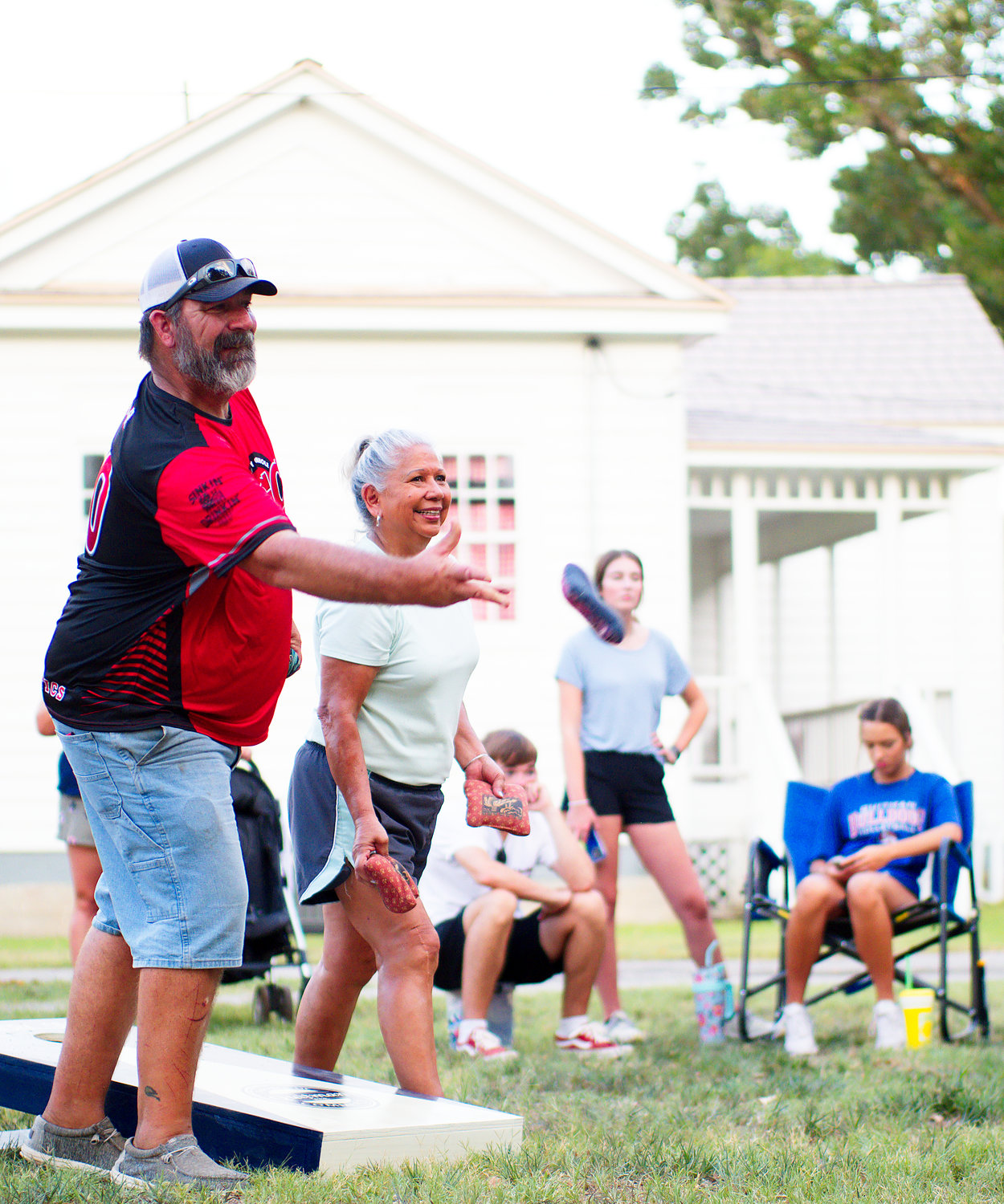 Aaron Graham of Alba tosses a bag during the championship match of the chamber of commerce corn hole tournament, which he and Kyle Frances won. [see more settlers moments]